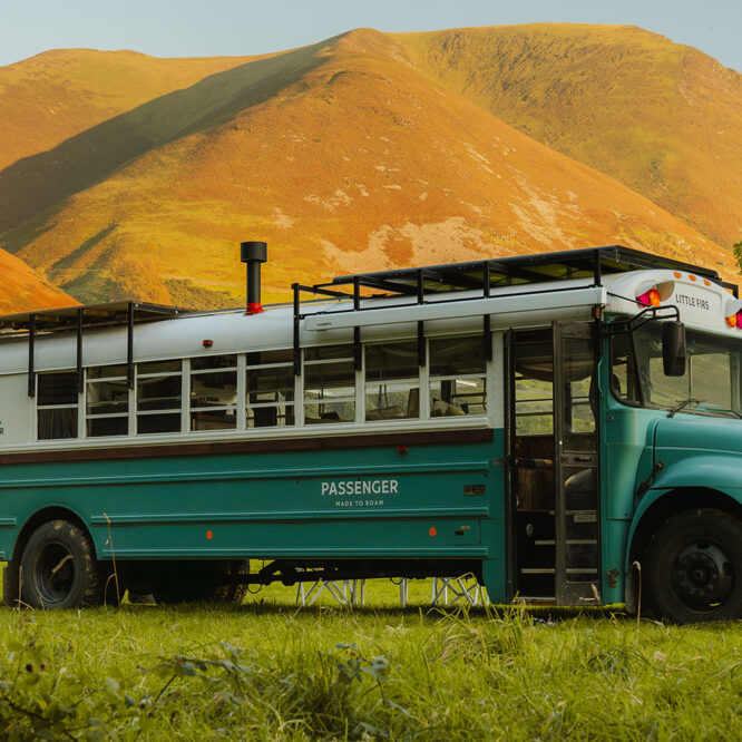 Exterior view of Passenger Clothing's off-grid skoolie Little Firs, a converted American school bus in the Lake District visited by Somewhere Wilder
