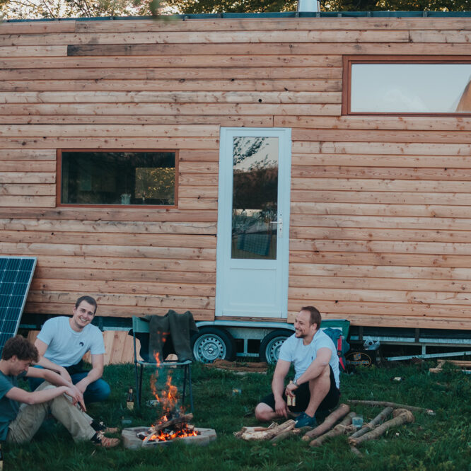 Exterior view of Célestine, a DIY tiny house on a trailer by Lake Genval, Belgium, built from recycled materials